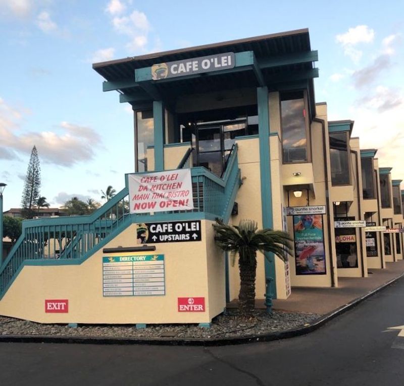 a building with a store on the side of a road