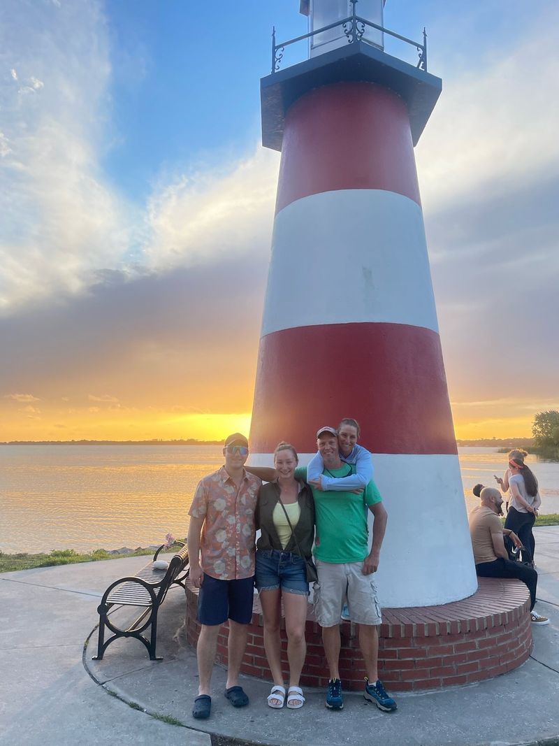 Family photo with the Mount Dora lighthouse at sunset
