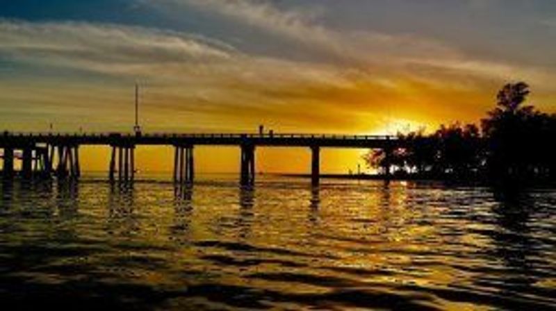 a sunset over a body of water