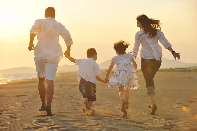 Family Have Fun On Oahu At Sunset