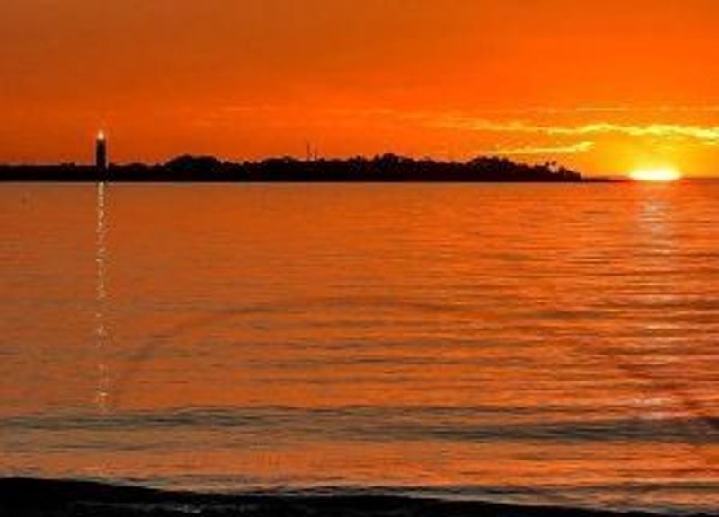 a sunset over a body of water