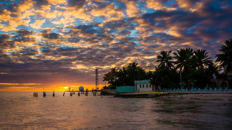 Sunset Over The Gulf Of Mexico From The Southernmost Point In Key West, Florida