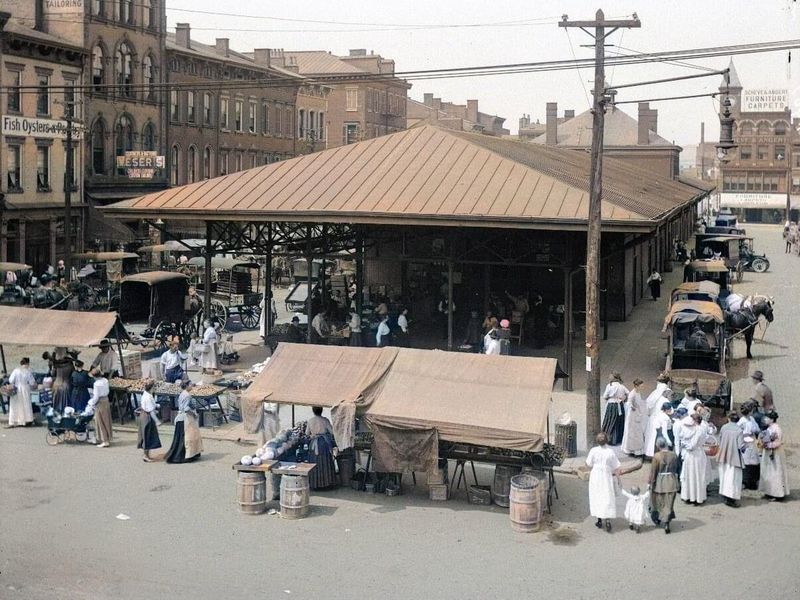 a group of people walking in front of a building