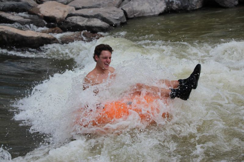person tubing down the San Juan River in Pagosa Springs