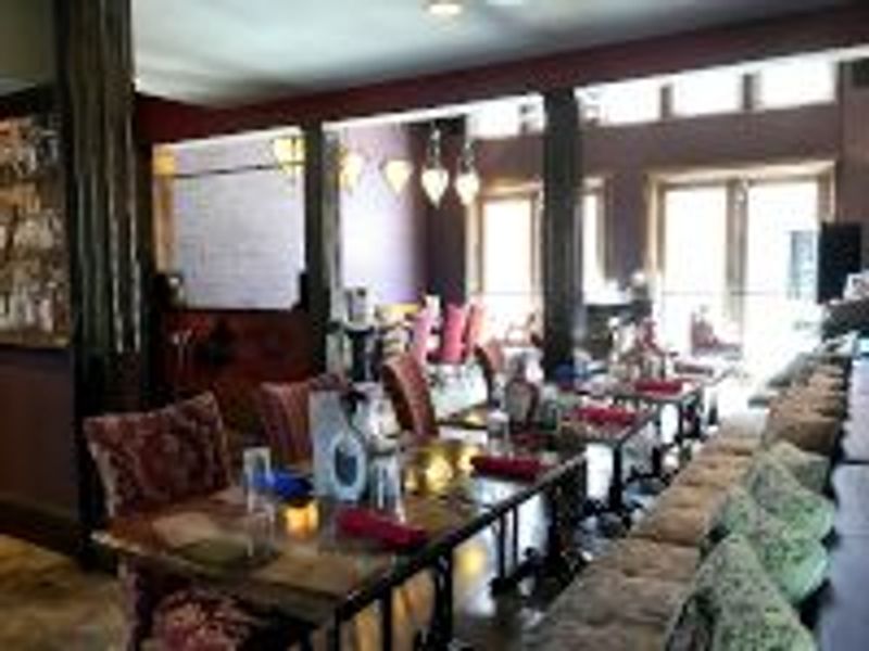 a room filled with furniture and a large window