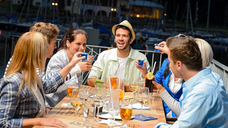 Friends Enjoying The Night At An Open Air Bar In Key West, Florida