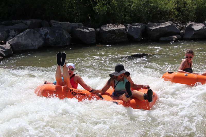 people tubing down the San Juan River in Pagosa Springs