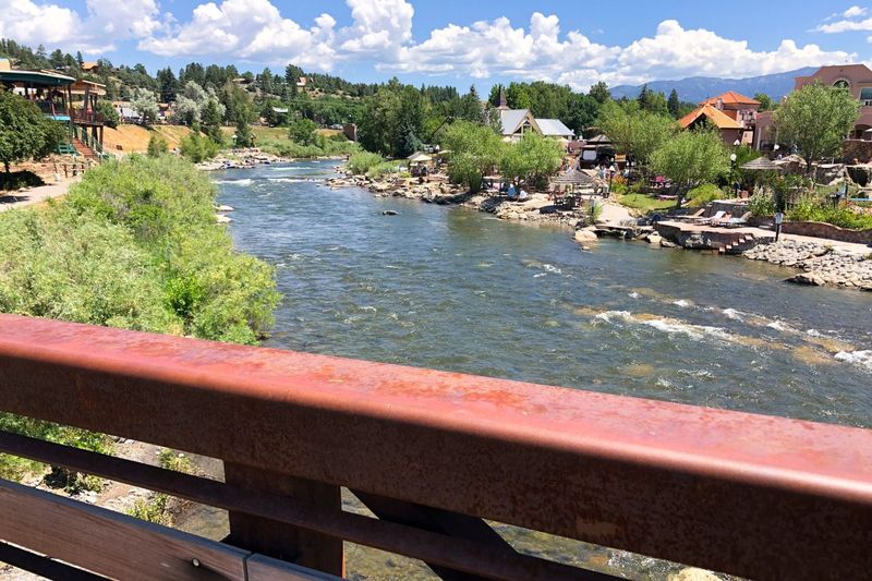 view of the San Juan River cutting through the middle of Pagosa Springs, CO
