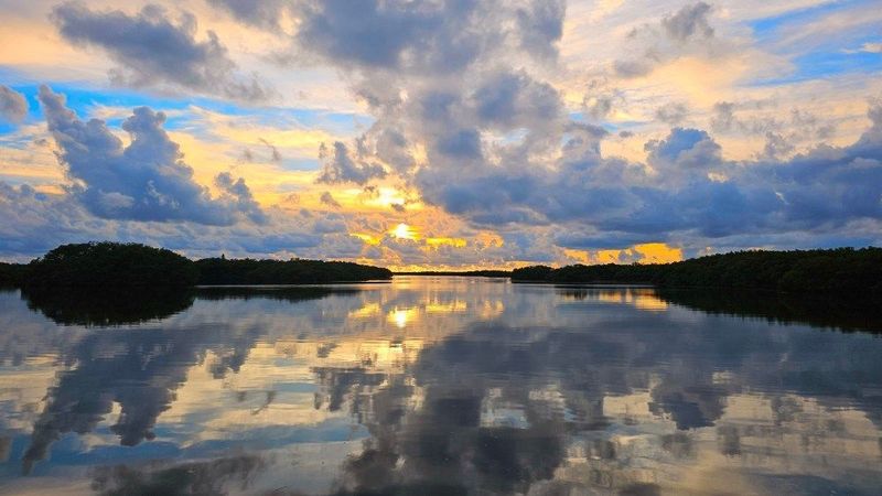 clouds in the sky over a body of water