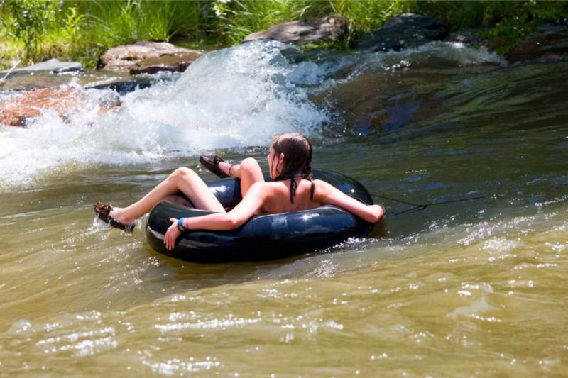 person tubing on Clear Creek in Golden, Colorado