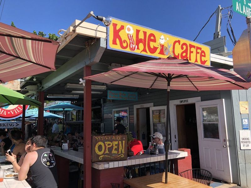 a person standing in front of a restaurant