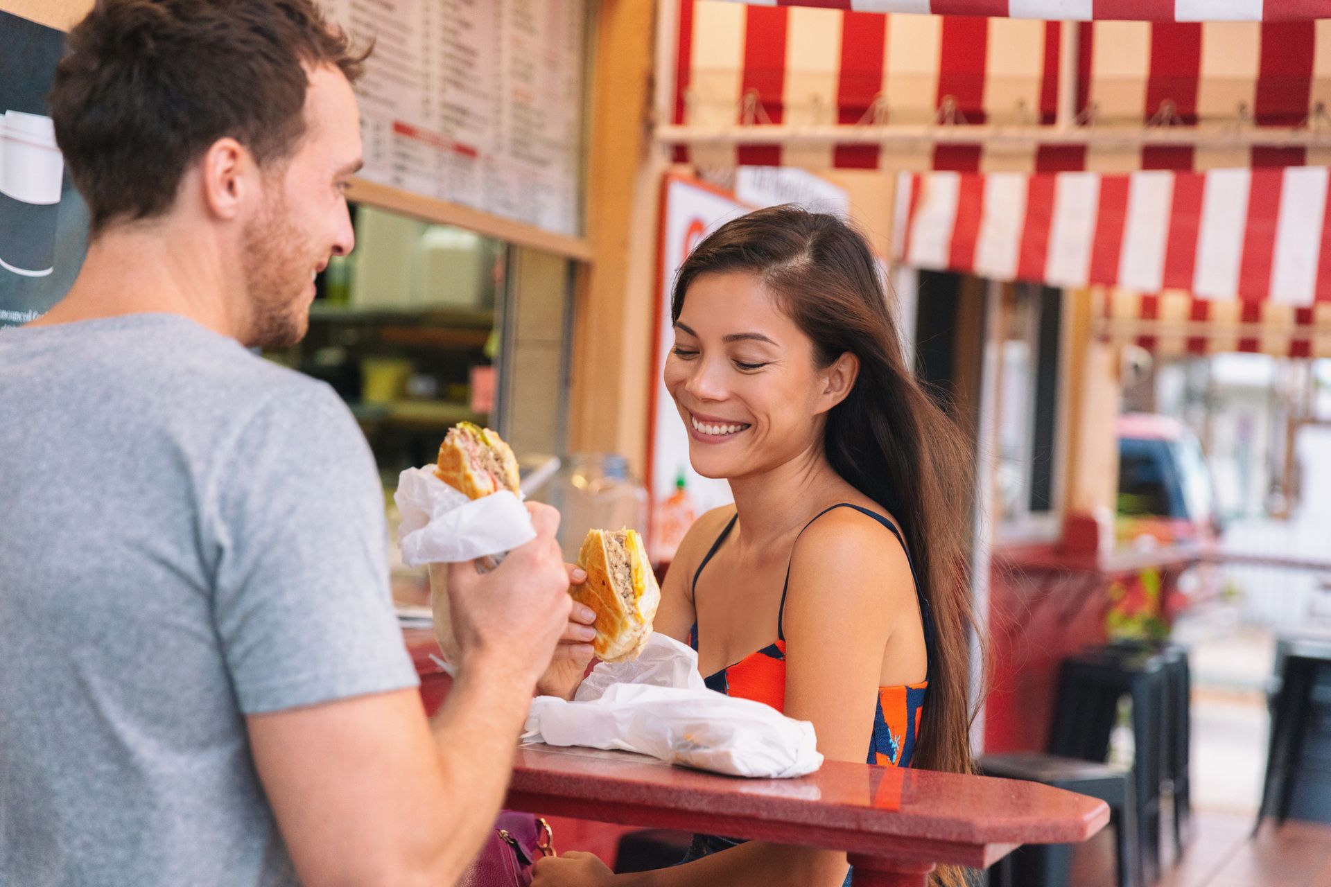 Happy Couple Eating Cuban Sandwich