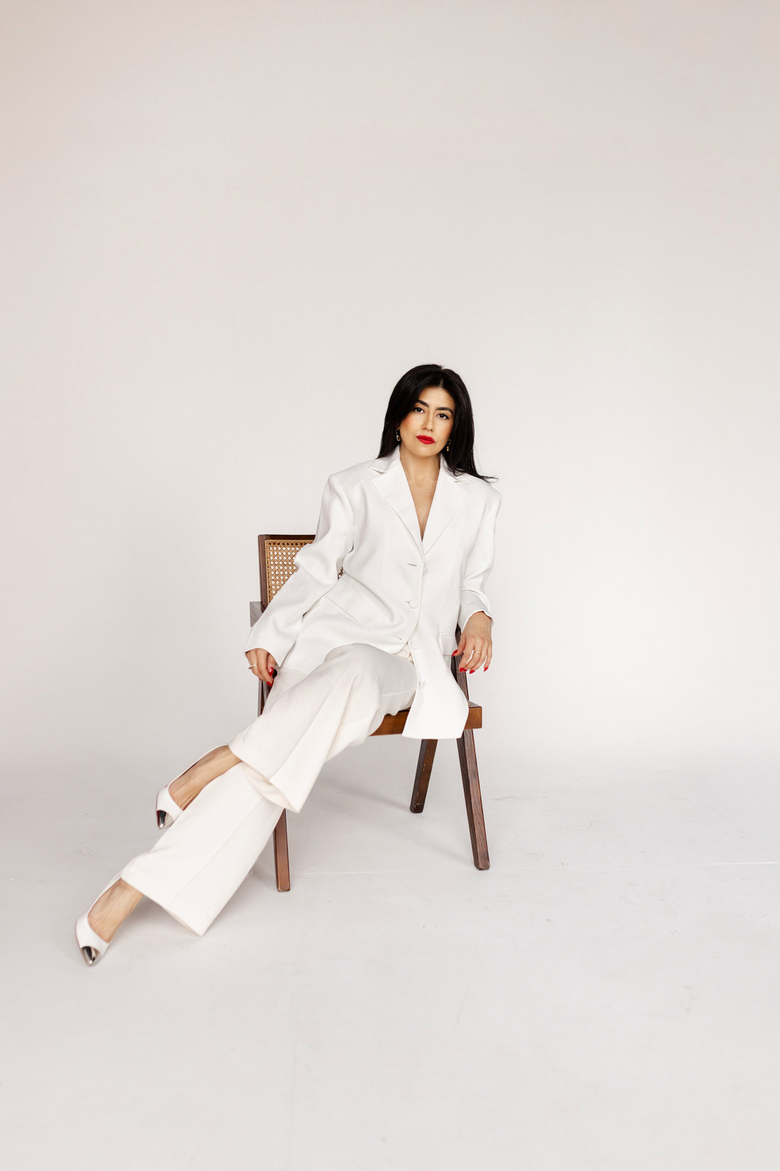 Charlene Lizette in a white suit