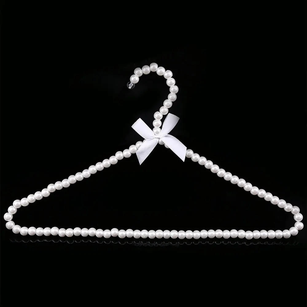 Description Picture 4 of item1/2pcs Plastic Pearl Beaded Bow Clothes Dress Coat Hangers Wedding For Kid Children Save-Space Storage Organizer Dry Rack