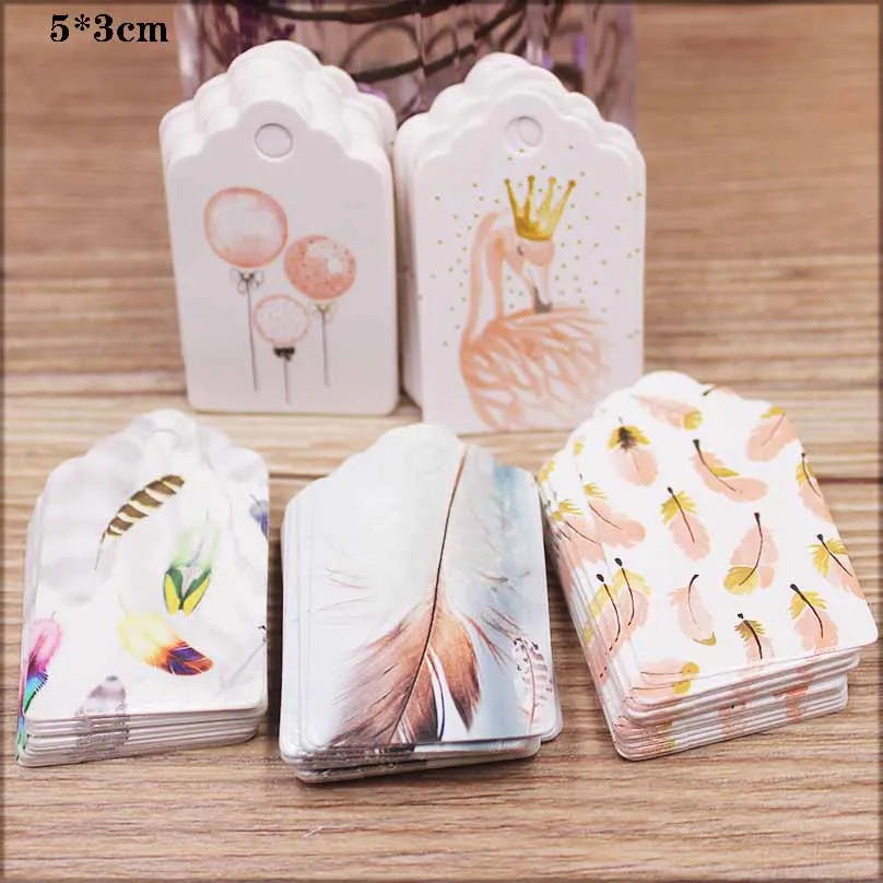 Description Picture 3 of itemParcking tag Scallop shape 5x3cm 100 tag white color  wedding candy gift tags Feathers pattern decoration hang tag party suppile