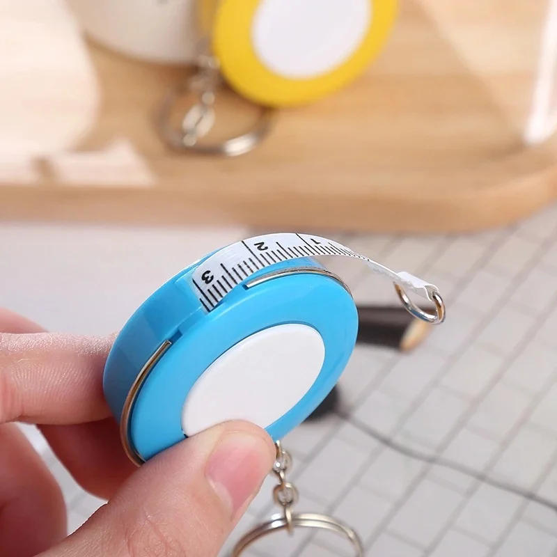 Description Picture 5 of item1PCS 150cm/60" Tape Measures Portable Retractable Ruler Mini Candy Color keychain Children Ruler Centimeter Inch Roll Tape