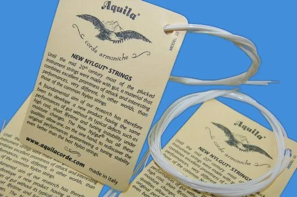 Description Picture 4 of item1-5 SET Ukulele 21 23 4 Strings Hawaii Small Guitar White Aquila Soprano Concert Nylon Parts  Accessories Musical Instruments