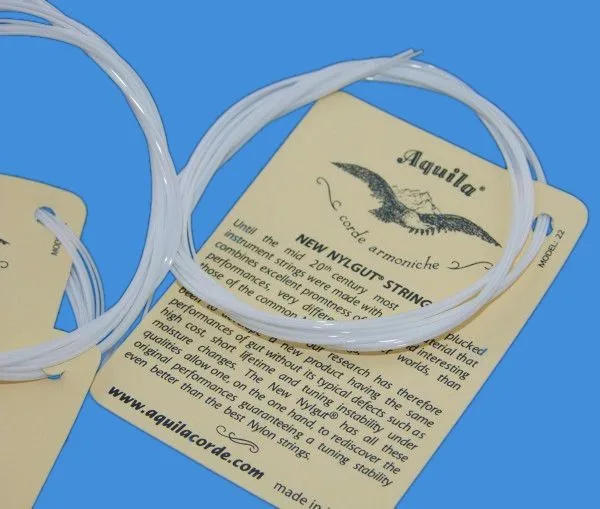 Description Picture 5 of item1-5 SET Ukulele 21 23 4 Strings Hawaii Small Guitar White Aquila Soprano Concert Nylon Parts  Accessories Musical Instruments