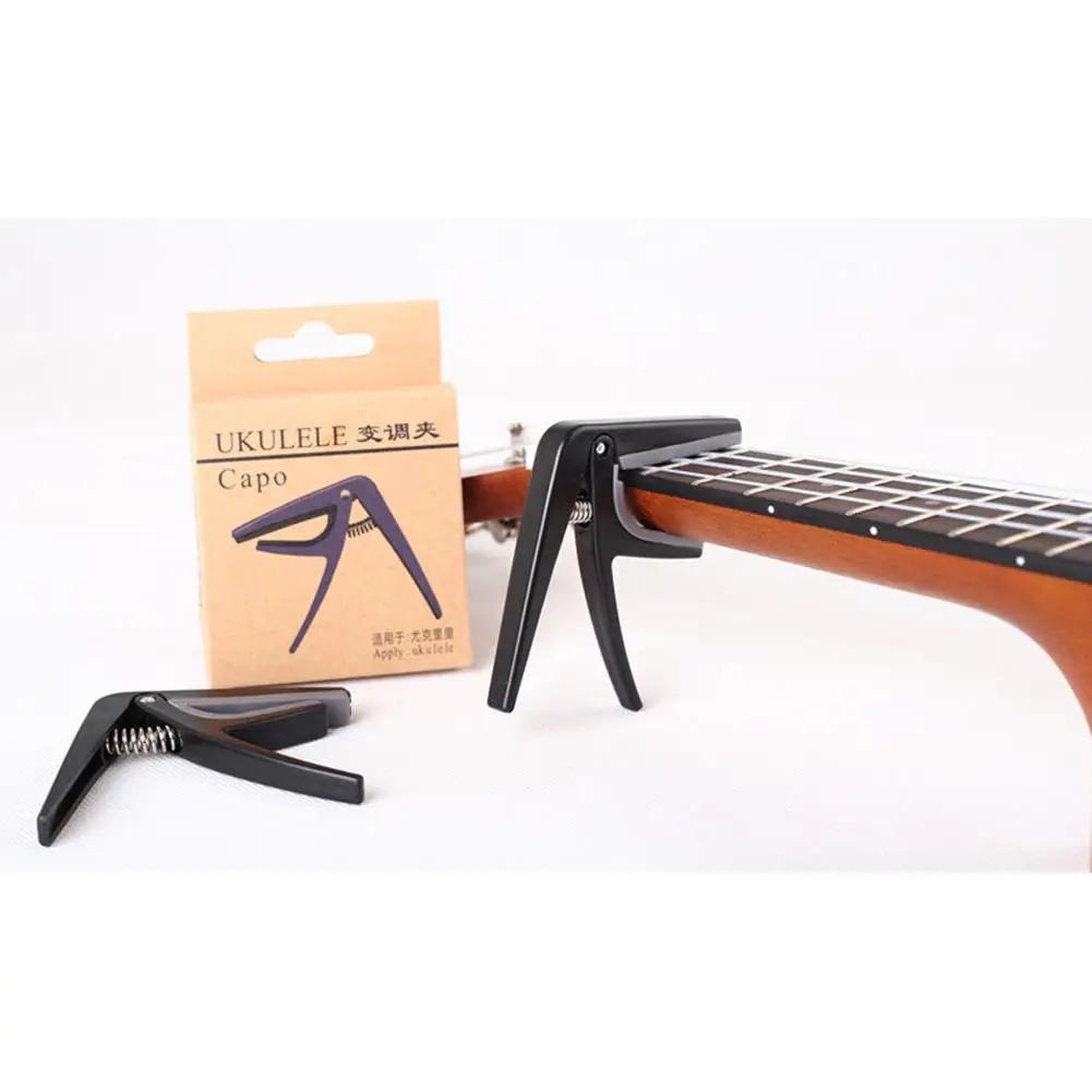 Description Picture 2 of itemProfessional Ukulele Capo 4 Strings Hawaii Guitar Capos Single-Handed Quick Replacement Change Guitar Parts & Accessories