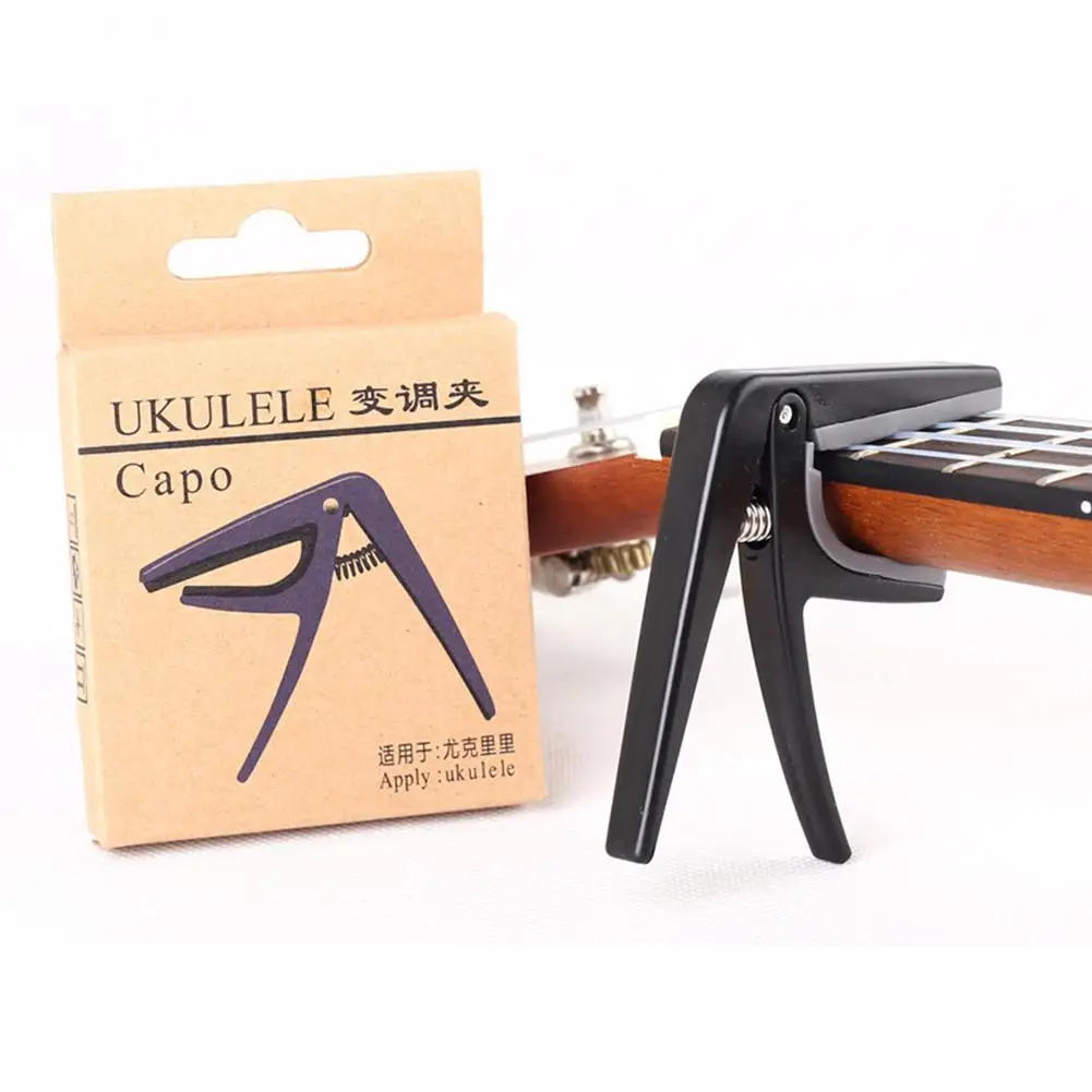Description Picture 5 of itemProfessional Ukulele Capo 4 Strings Hawaii Guitar Capos Single-Handed Quick Replacement Change Guitar Parts & Accessories