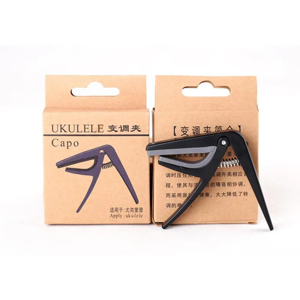 Description Picture 4 of itemProfessional Ukulele Capo 4 Strings Hawaii Guitar Capos Single-Handed Quick Replacement Change Guitar Parts & Accessories