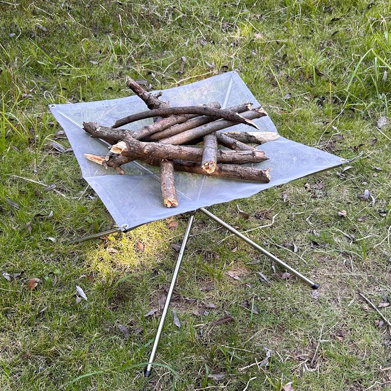 Description Picture 6 of itemLighten up Fire Pit Burning Rack Camping Stainless Steel Mesh Fireplace Foldable Stove BBQ Grill Patio With Replace Grilled Net