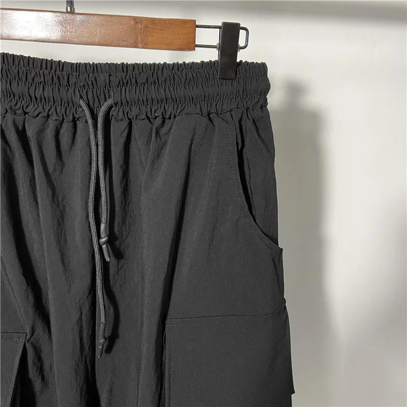 Description Picture 6 of itemHop Hip Mens Harem Pants Drawstring Elastic Waist Loose Bloomers Gothic Big Pocket Cargo Pants New Summer Casual Sweatpants Men