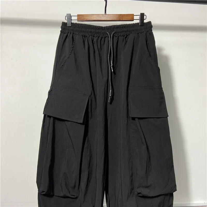 Description Picture 5 of itemHop Hip Mens Harem Pants Drawstring Elastic Waist Loose Bloomers Gothic Big Pocket Cargo Pants New Summer Casual Sweatpants Men