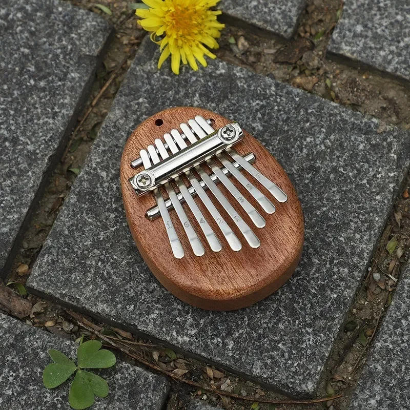 Description Picture 6 of itemNewest 8 Key Mini Kalimba Thumb Piano Wooden/Acrylic Small Wearable Musical Instrument Pendant Mbira Finger Piano For Adult Kids