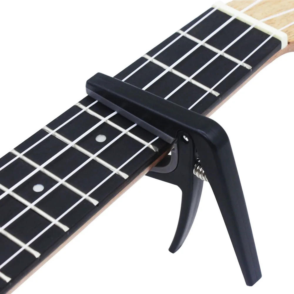 Description Picture 2 of itemProfessional Ukulele Capo Single-handed Quick Change Ukelele Capo Hawaii Guitar Capos Guitar Parts & Accessories