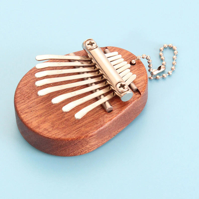 Description Picture 5 of itemThumb Piano 8 Key Mini Kalimba Exquisite Finger Piano Portable Marimba Musical Pendant Gift 8 Key Keyboard Musical Instrument