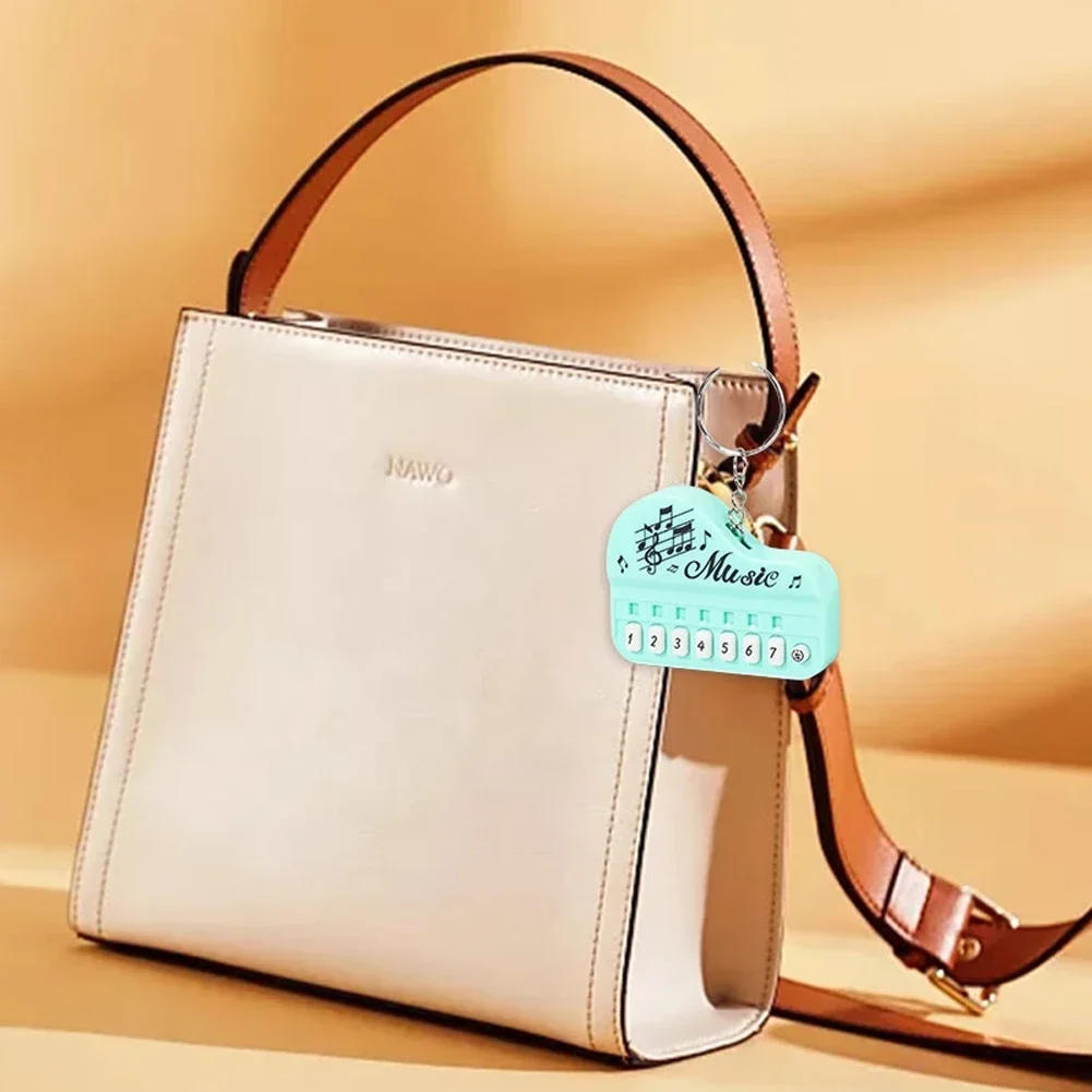 Description Picture 4 of itemNew Piano Toy Keychain Mini Electronic Organ Piano Key Chain with Lights Multifunctional Electronic Piano Pendant Keyring Gift