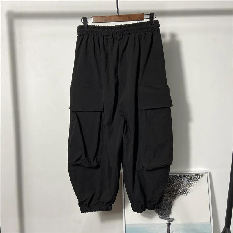 Description Picture 4 of itemHop Hip Mens Harem Pants Drawstring Elastic Waist Loose Bloomers Gothic Big Pocket Cargo Pants New Summer Casual Sweatpants Men