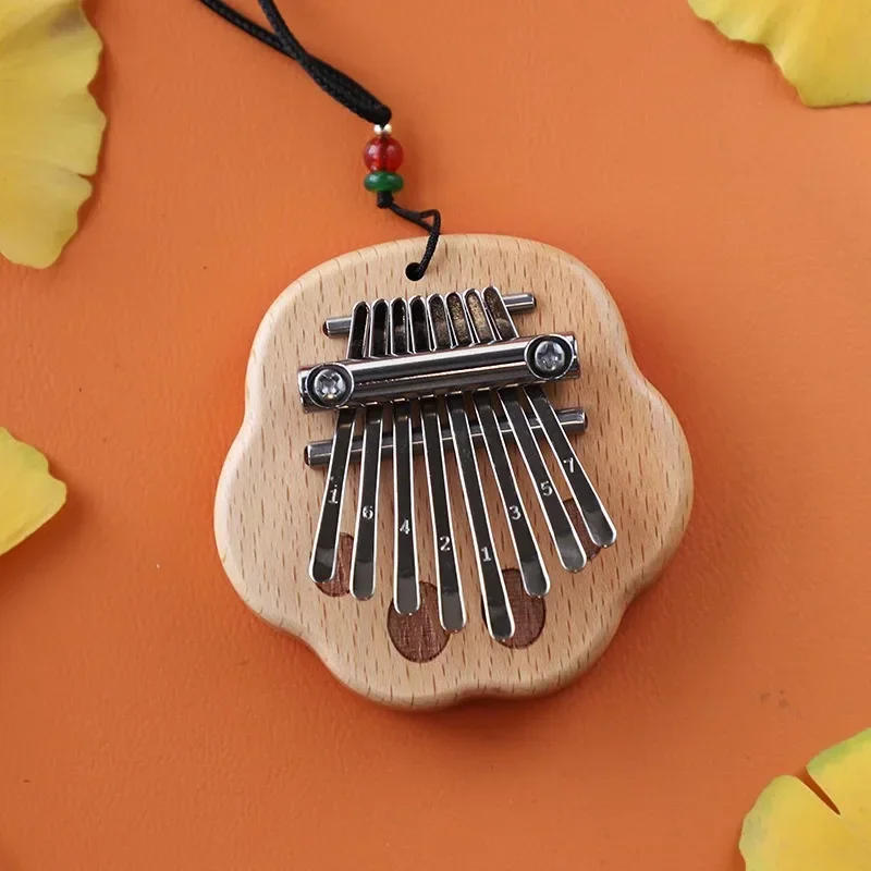 Description Picture 3 of itemNewest 8 Key Mini Kalimba Thumb Piano Wooden/Acrylic Small Wearable Musical Instrument Pendant Mbira Finger Piano For Adult Kids