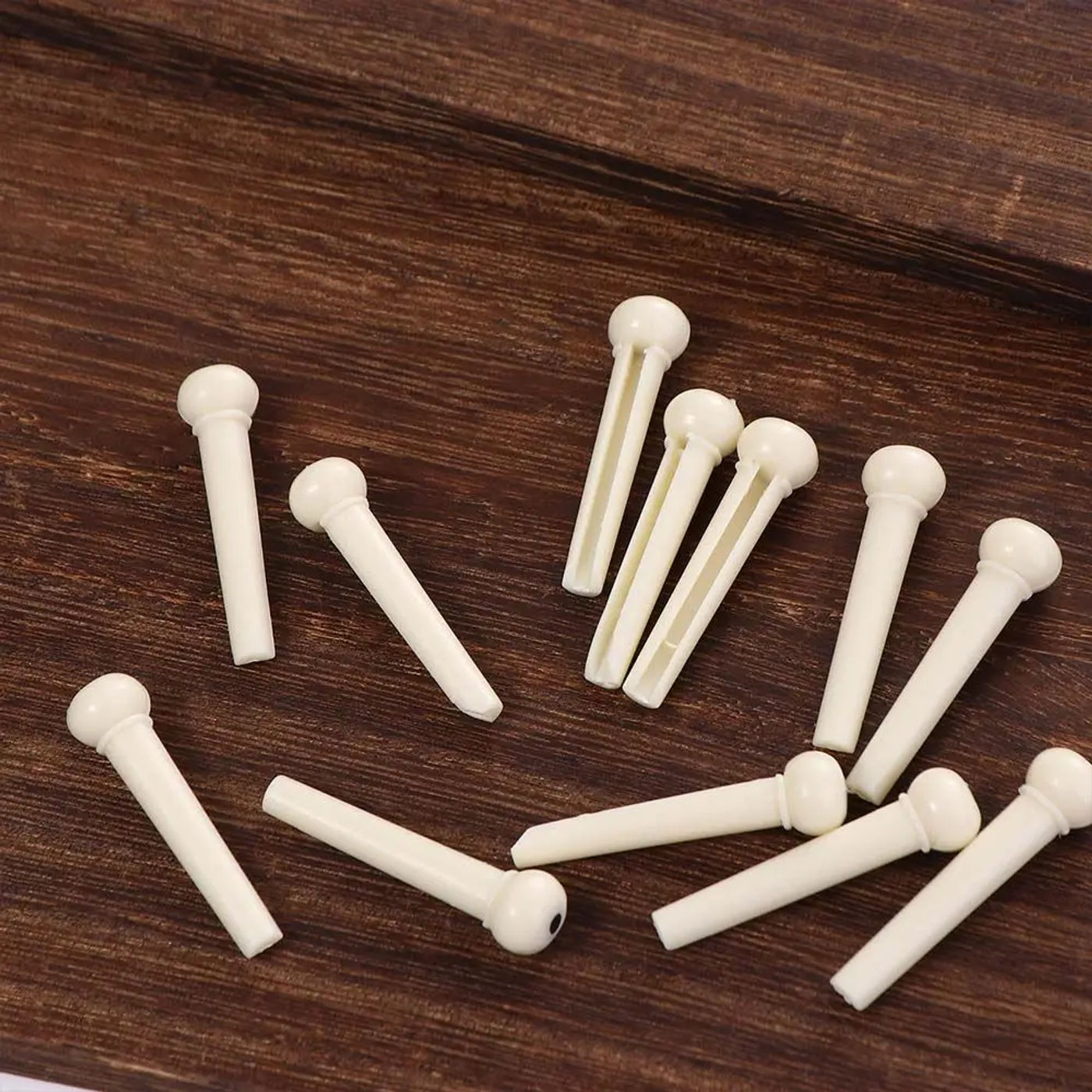 Description Picture 6 of item12pcs Parts Instruments Accessories Acoustic Guitar Guitar Strings Nail Extractor Guitar Set Guitar Bridge Pins Pegs Guitar Pegs