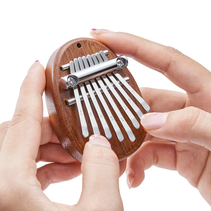 Description Picture 4 of itemMini Kalimba 8 Key Thumb Piano 1 Pack Water Drop Style Cute Instrument Portable Exquisite Gift Set for Kids
