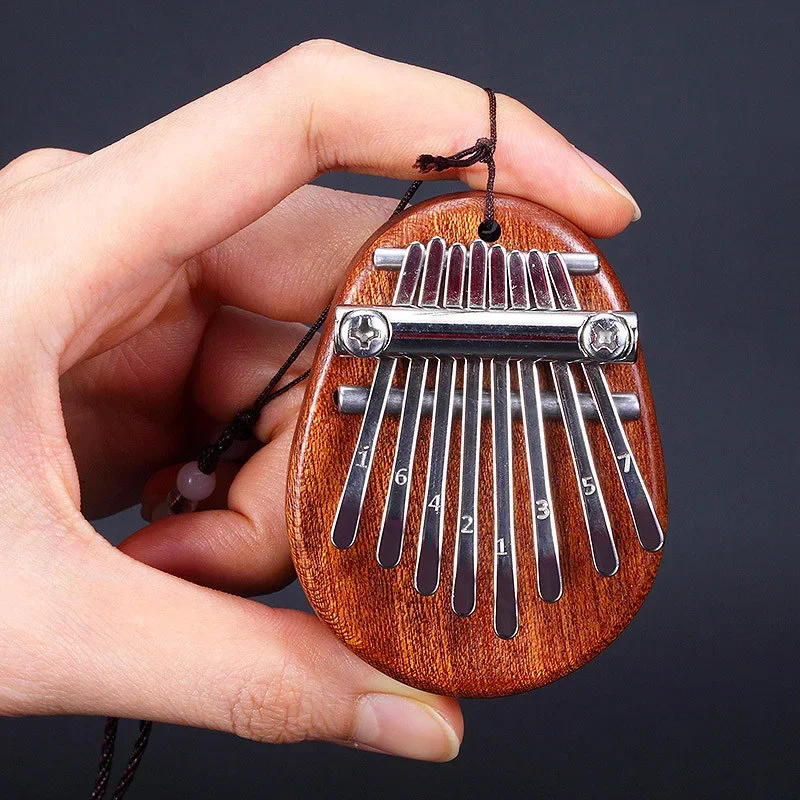 Description Picture 4 of itemSmall 8-note thumb harp shrapnel Kalimba instrument accessories Steel stamped letter thumb keys