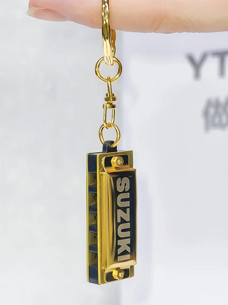 Description Picture 5 of itemSuzuki Harmonica Mini 5 Holes 10 Tone Harmonica Keychain Key of C Golden Woodwind Instruments Gift