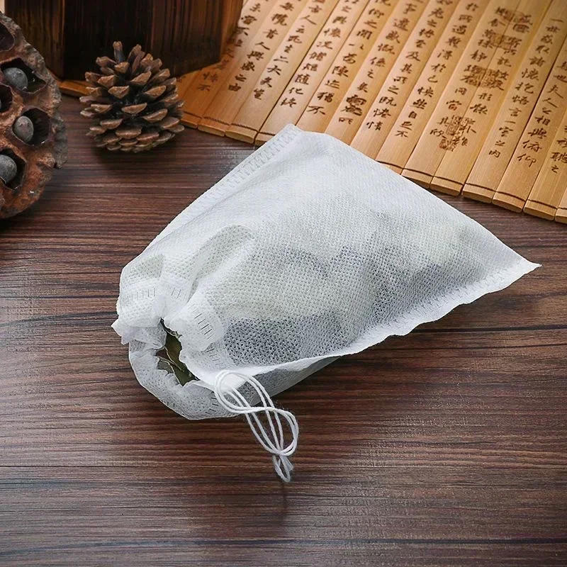 Description Picture 5 of item100PCS Disposable Non-woven Fabric Teabags With String Kitchen Teaware Coffee Loose Tea Spice Bag Wholesale Tea Filter Bags