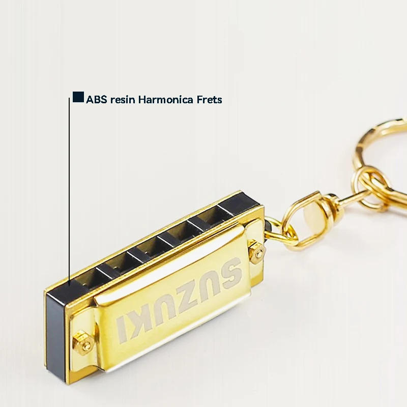 Description Picture 4 of itemSuzuki Harmonica Mini 5 Holes 10 Tone Harmonica Keychain Key of C Golden Woodwind Instruments Gift