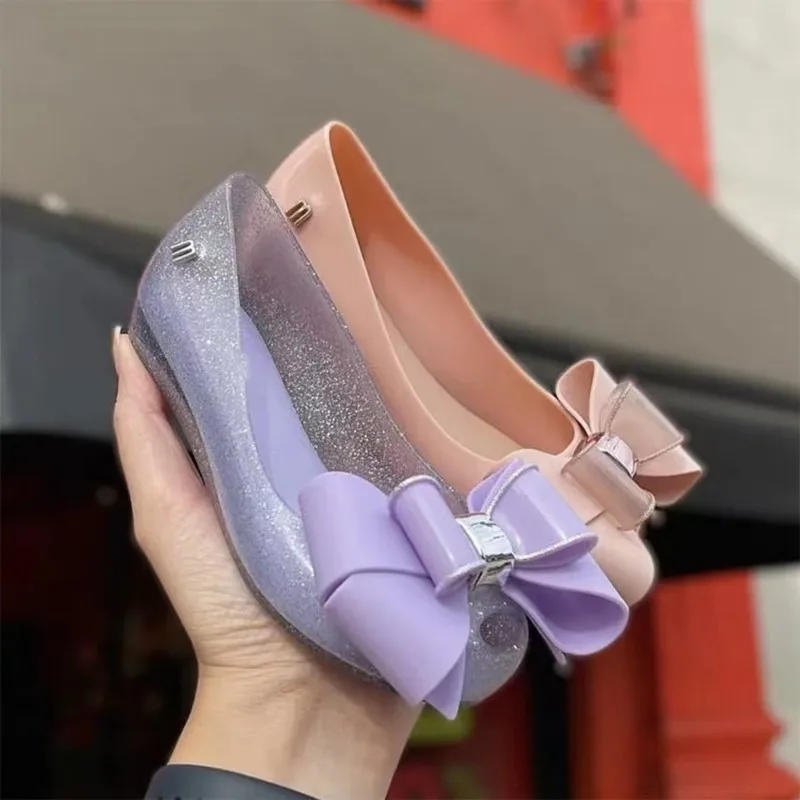 Description Picture 4 of itemNew Style Hot Sale Spring Children Single Jelly Shoes Sister's Fashion Big Bow Princess Flat Summer Beach Sandals HMI104