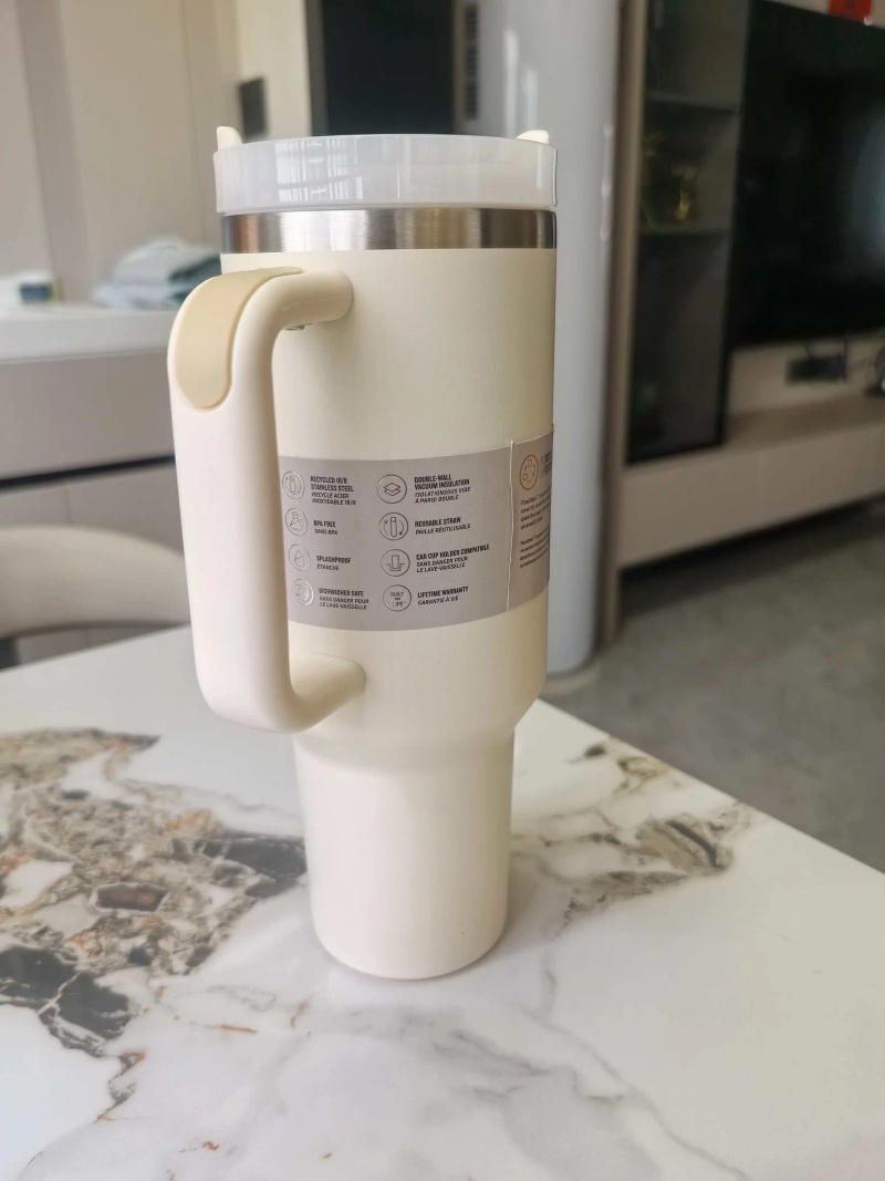 Description Picture 4 of item40 oz tumbler with handle and straw | Cup holdefor travel | Insulated stainless steel cup | BPA-freeColor milky white1000-1500mm