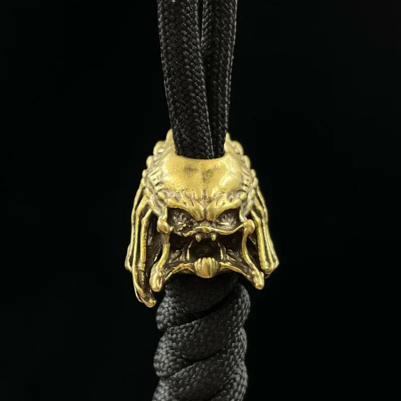 Description Picture 5 of itemAlien Beast Face Iron Warrior Knife Bead Handmade Woven Paracord Lanyard DIY Pendants Jewelry Accessories Brass EDC Outdoor Tool