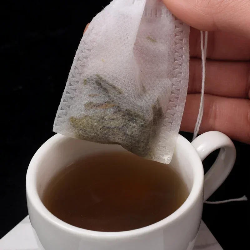 Description Picture 4 of item50pcs/lot Disposable Teabags Non-woven Fabric Tea Filter Bags for Coffee Spice Tea Bag with Drawstring Filters Kitchen Teaware