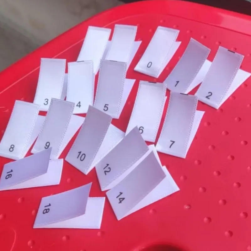 Description Picture 4 of item50pcs White Satin Cloth Size Label Print Double Sizes Labels 000 00 0 1 2 3 4 5 6 7 8 9 10 12 14 16 18 Garment Tag