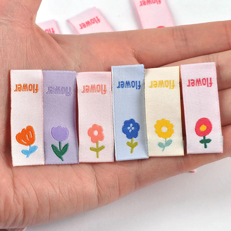 Description Picture 3 of item50pcs 41x15mm Cute Flower Embroidery Labels DIY Garment Accessories Handmade Clothing Bag Shoes Tags Kids Sewing Crafts cp3630