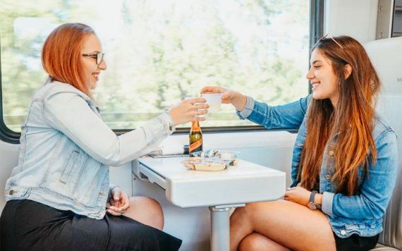 Ladies with snacks and beverages on the Brightline