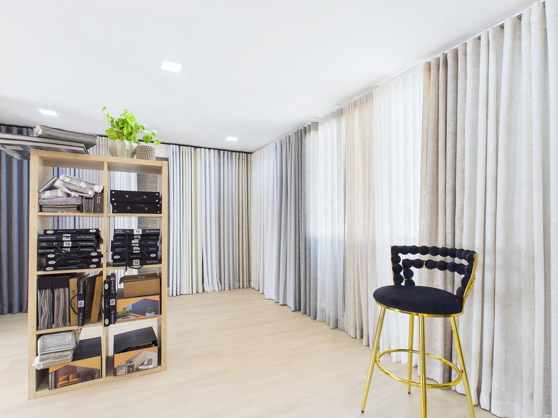 Showroom interior with fabric samples and curtain display