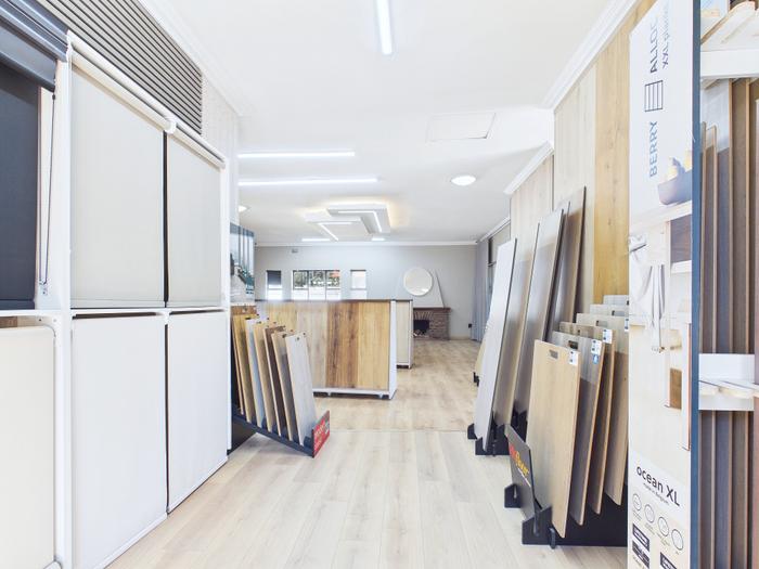 Roller blinds on display in the showroom