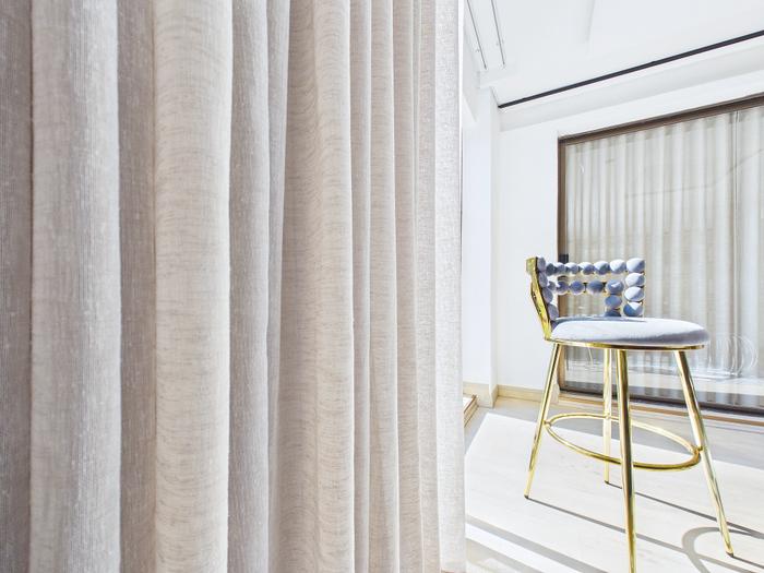 Close detail of soft cascading curtain fabric